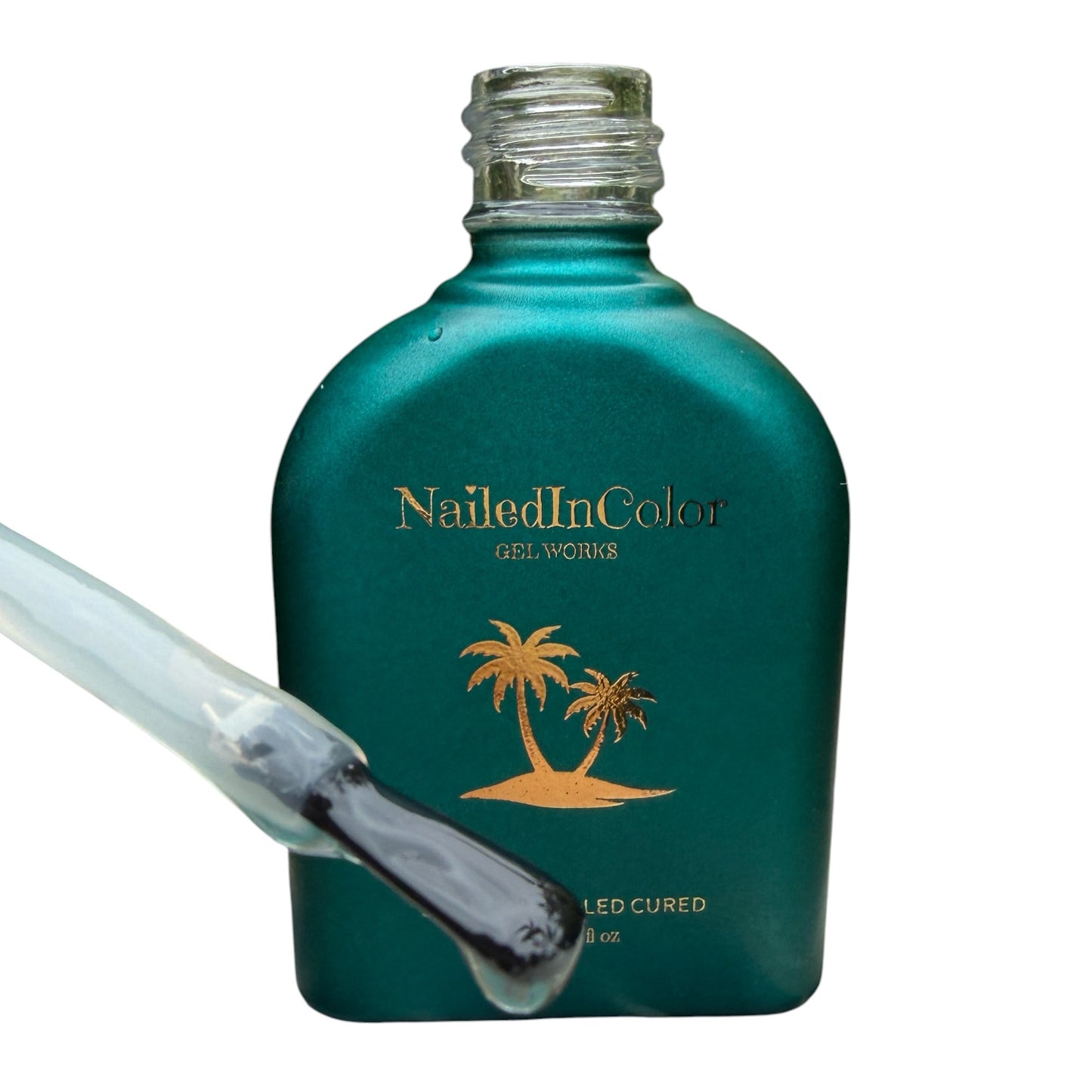 Teal bottle of Nailed In Color gel with a nail polish brush showing topcoat on a white background