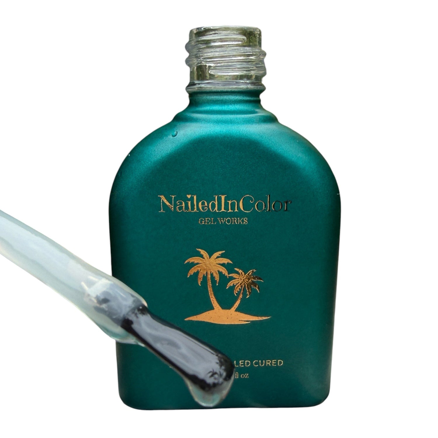 Teal bottle of Nailed In Color gel with a nail polish brush showing topcoat on a white background