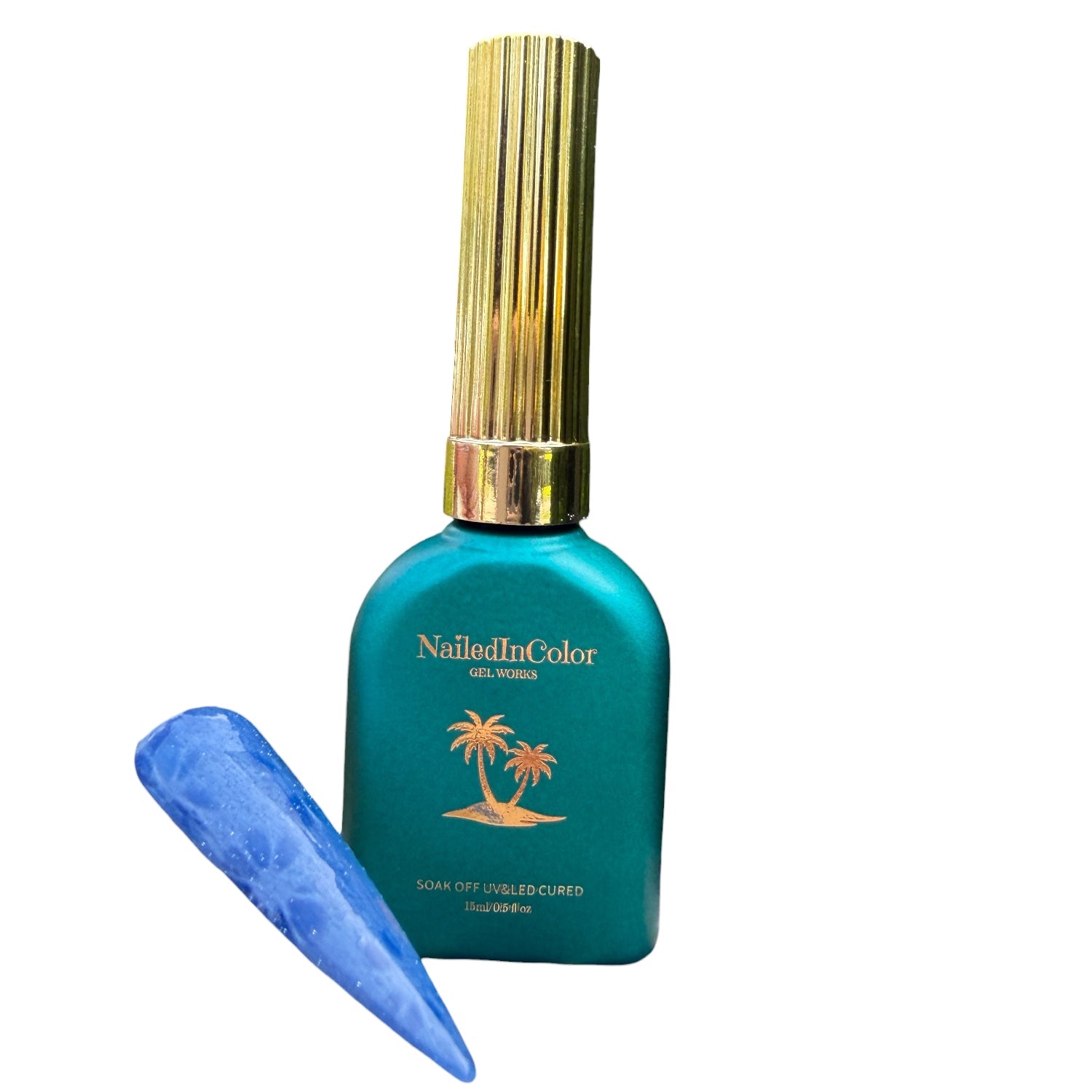 Teal nail polish bottle with gold cap and blue nail sample on a white background