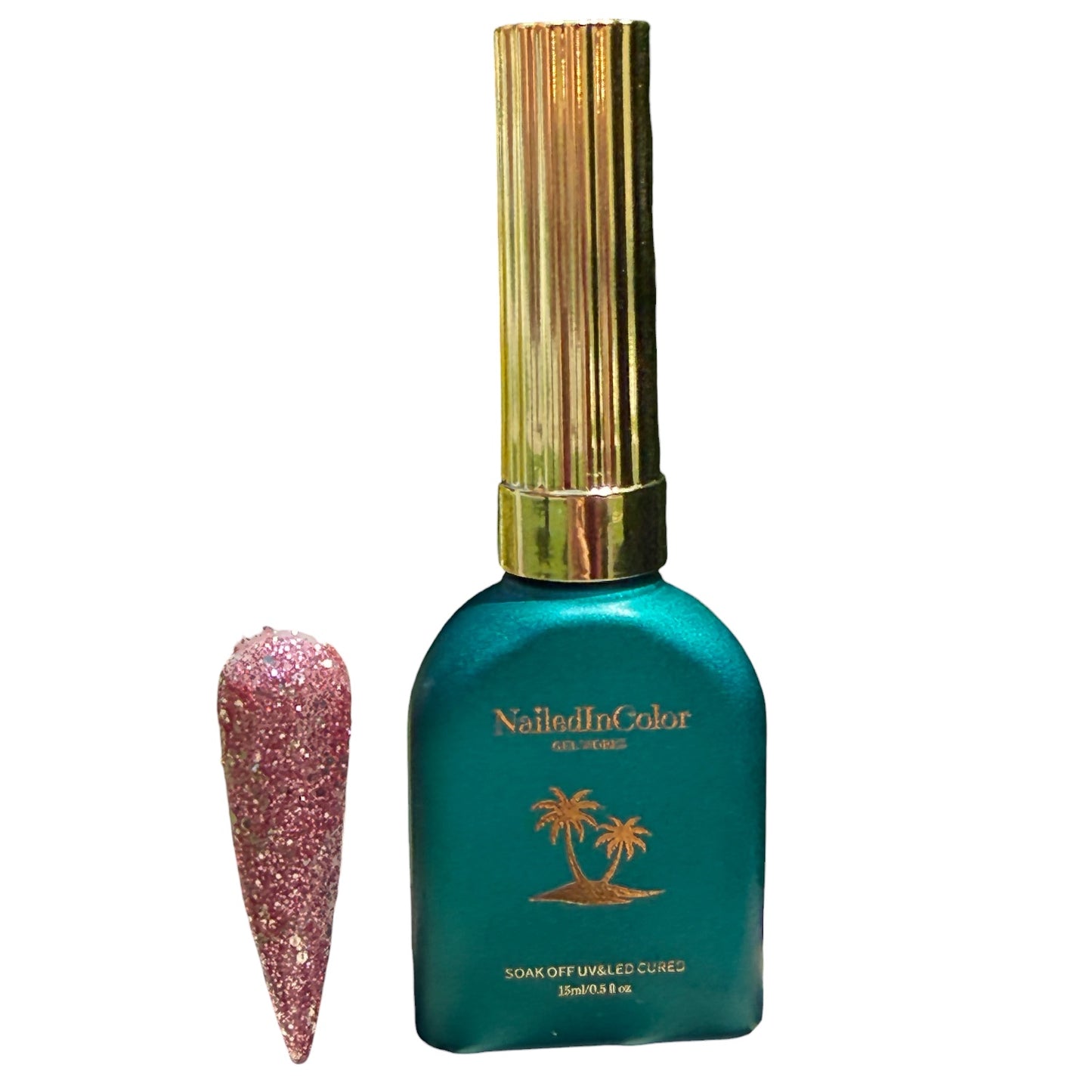 Teal nail polish bottle with gold cap and glittery pink nail tip on a white background