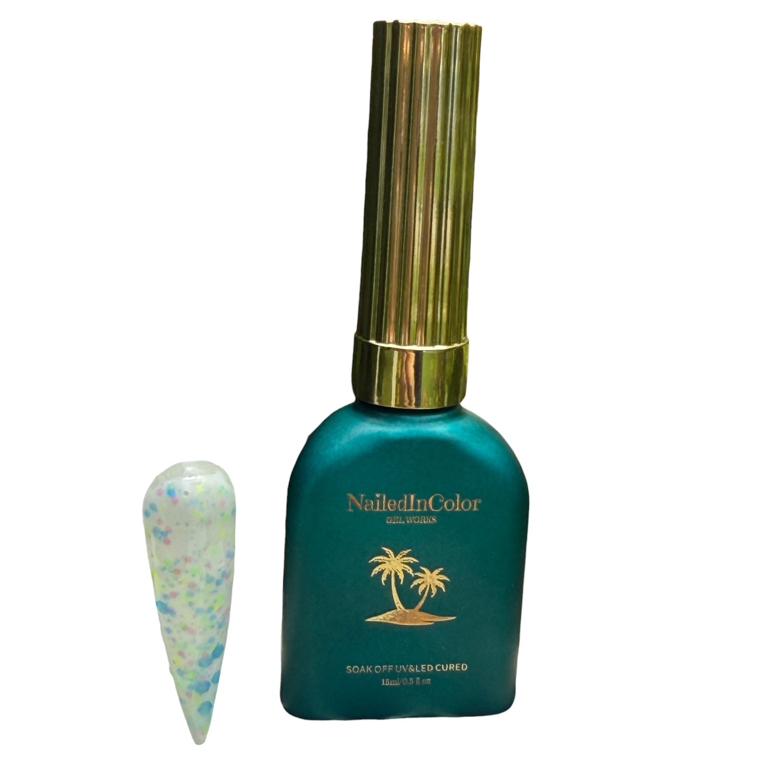 Green nail polish bottle with gold cap and 'Nailed in Color' branding on a white background with a polished nail swatch with multicolor flakes