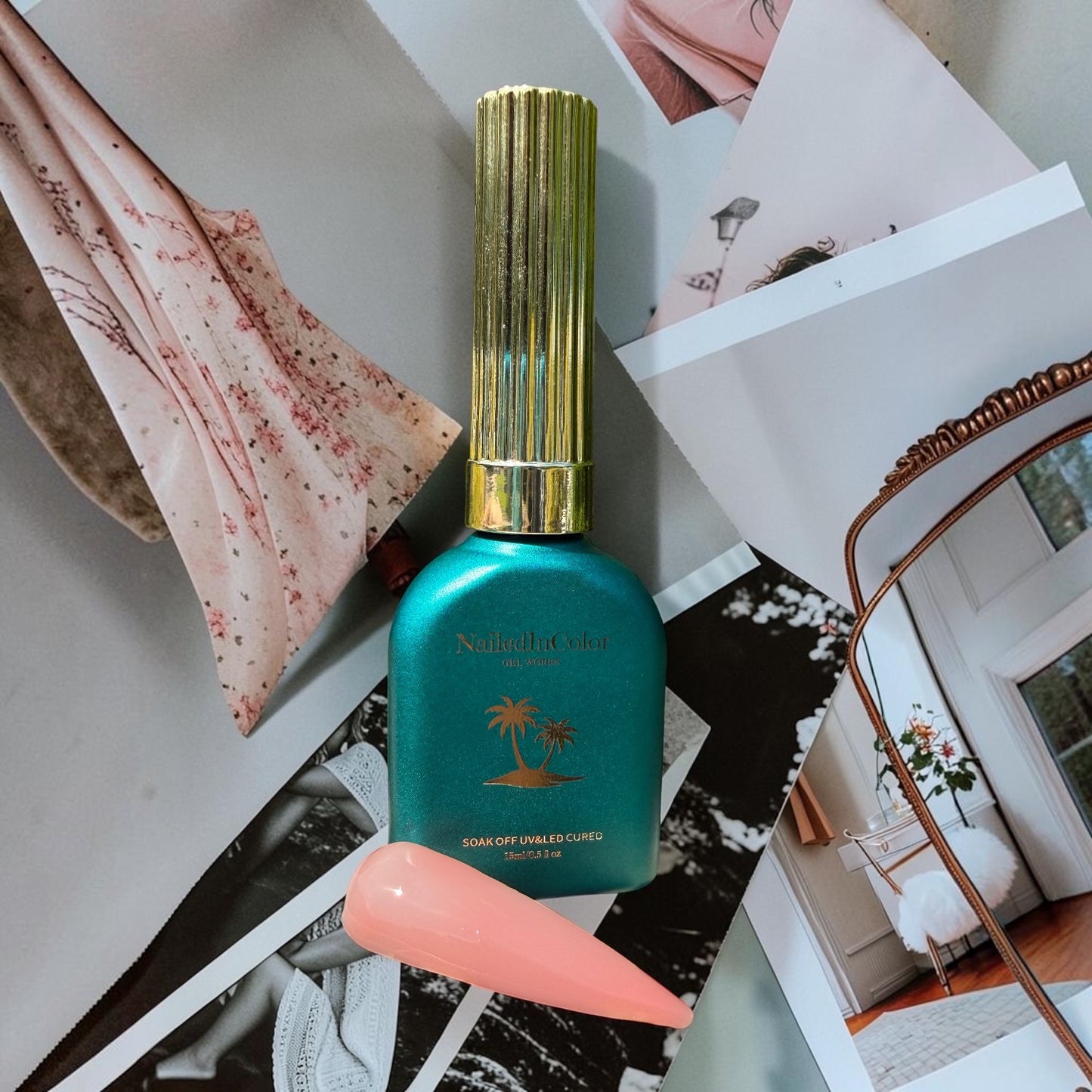 Teal nail polish bottle with gold cap on a collage background with a light pink nail tip done in builder gel