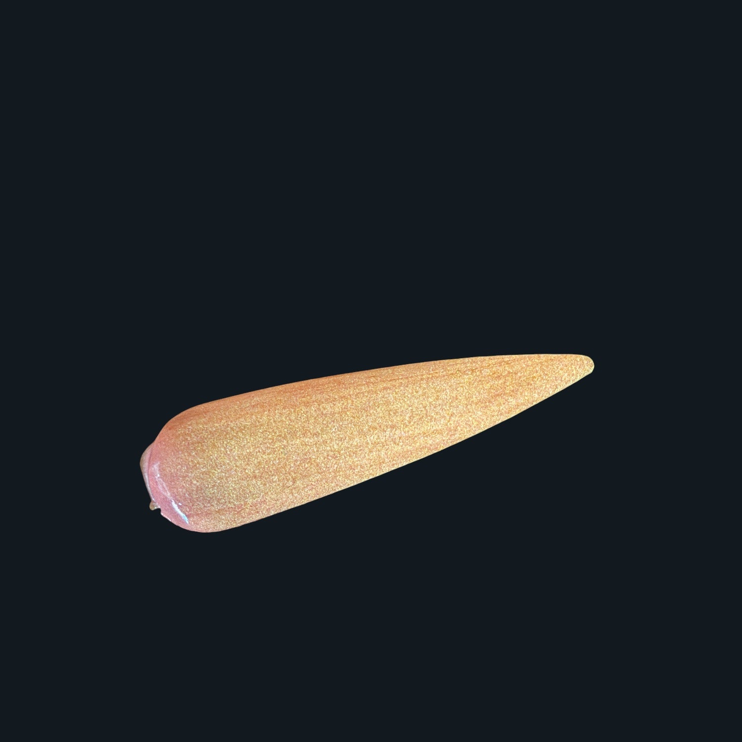 Glow in the dark nail tip in orange on black background