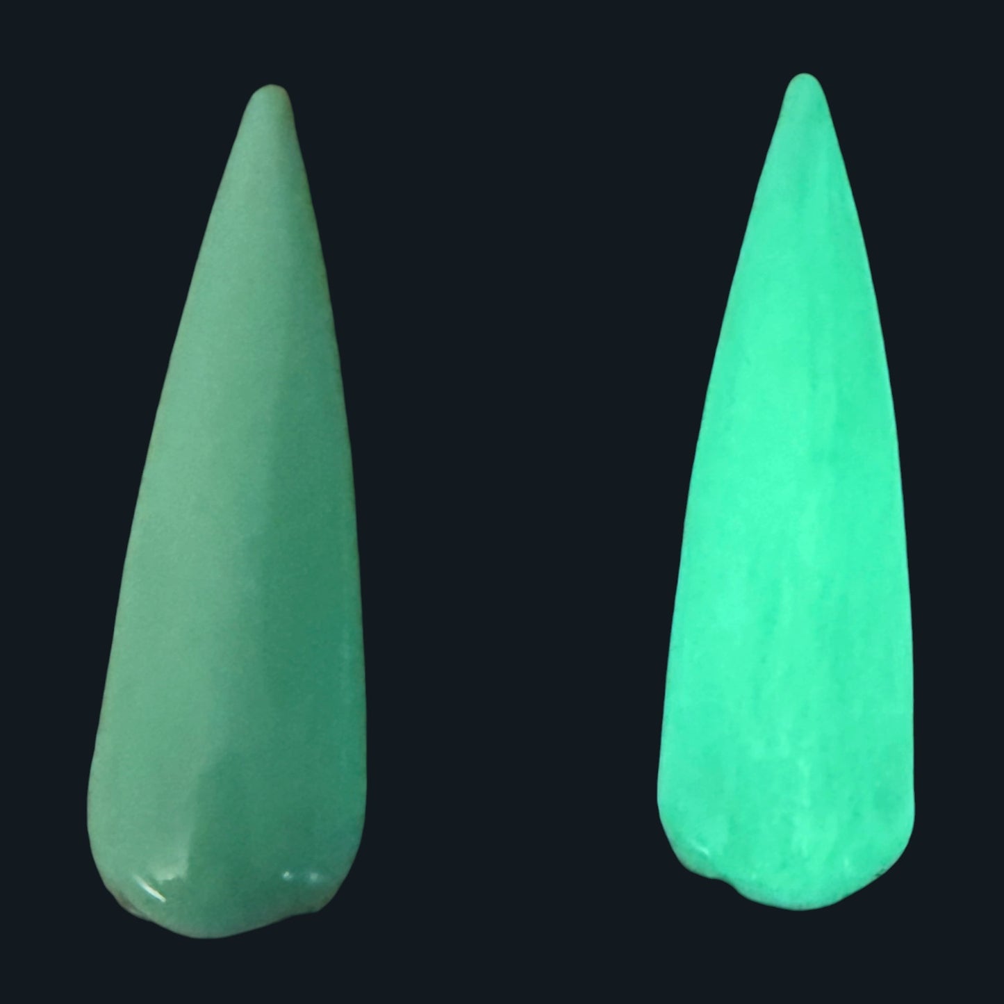 Green nail tip next to a glow in the dark green nail tip on a black background